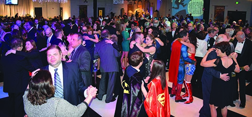 Superheroes and supervillains hit the dance floor.
