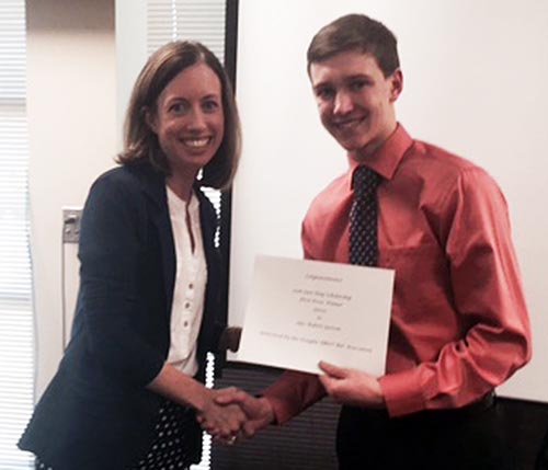 Rebecca Goldmanis of Kokish & Goldmanis P.C. in Castle Rock presenting Alec Greven with his Law Day scholarship.